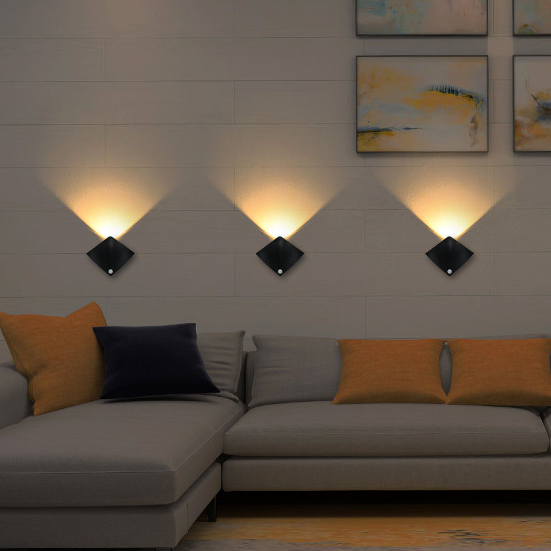 Halo warm-white wall lights above a sofa; sold individually