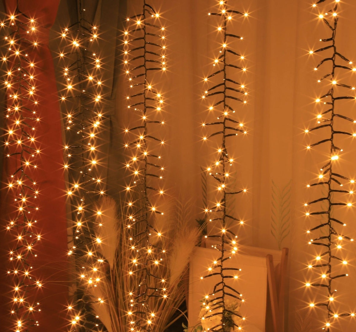 Cascade warm-white strands styled as a decorative hanging display